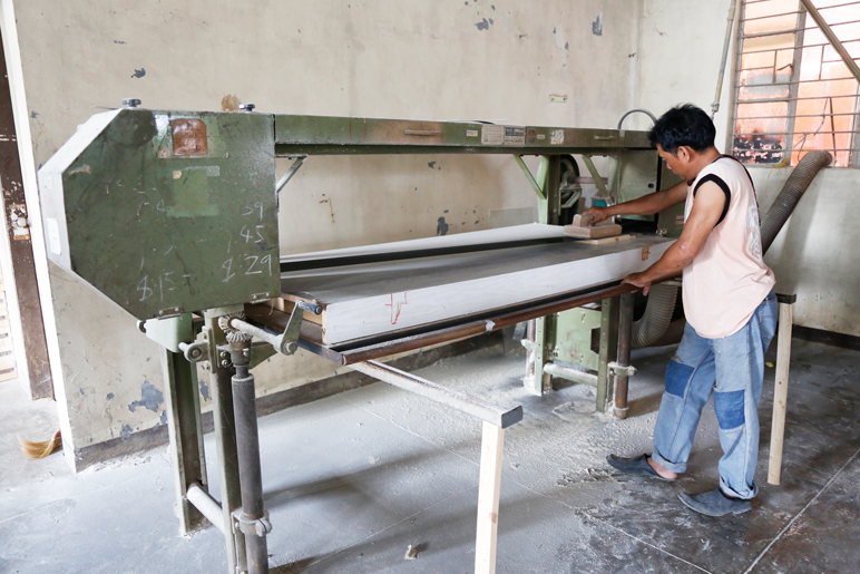 Balai Kamay carpenter making sure every wood is painstakingly made, working on a part for one of their products