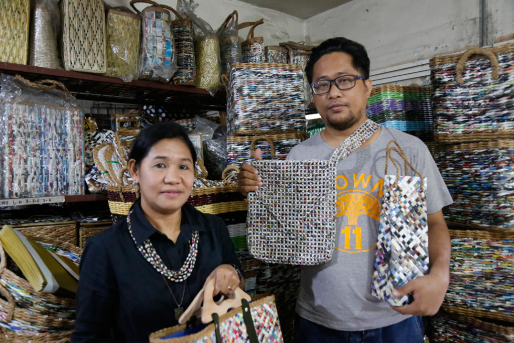 Joyet Castor, Chairperson of SMP–MPC, posing with the coop's creations.