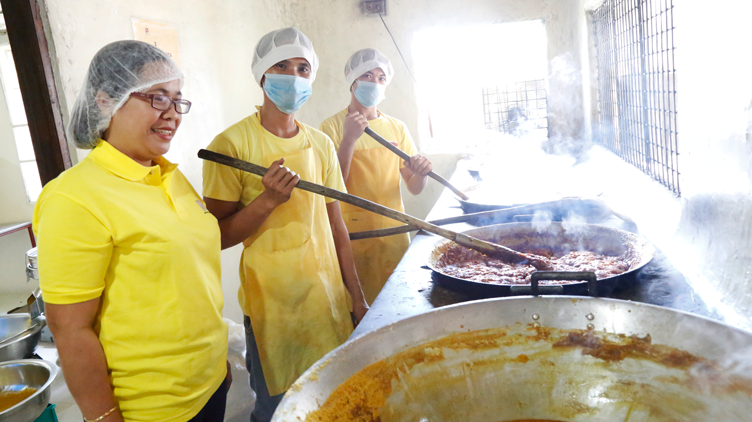 Mira’s Turmeric Products owner Almira Silva joining her employees in cooking the turmeric roots