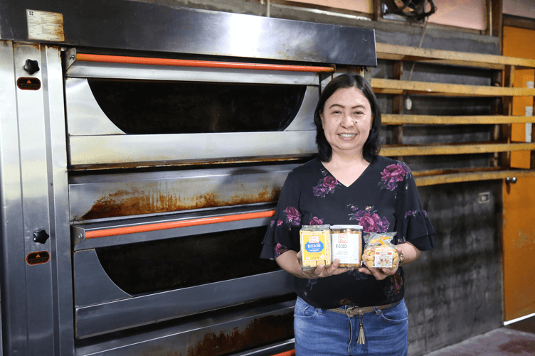 Baker's Field owner Ester Perez holding up their best sellers