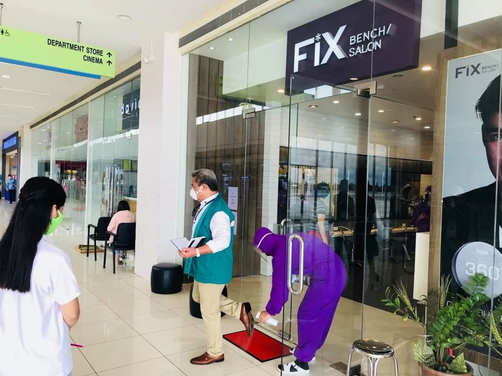 Disinfecting station at the entrance of a salon in a mall in Region 9