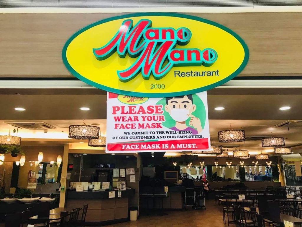 Signage at the entrance of Mano Mano restaurant in a mall in Region 9