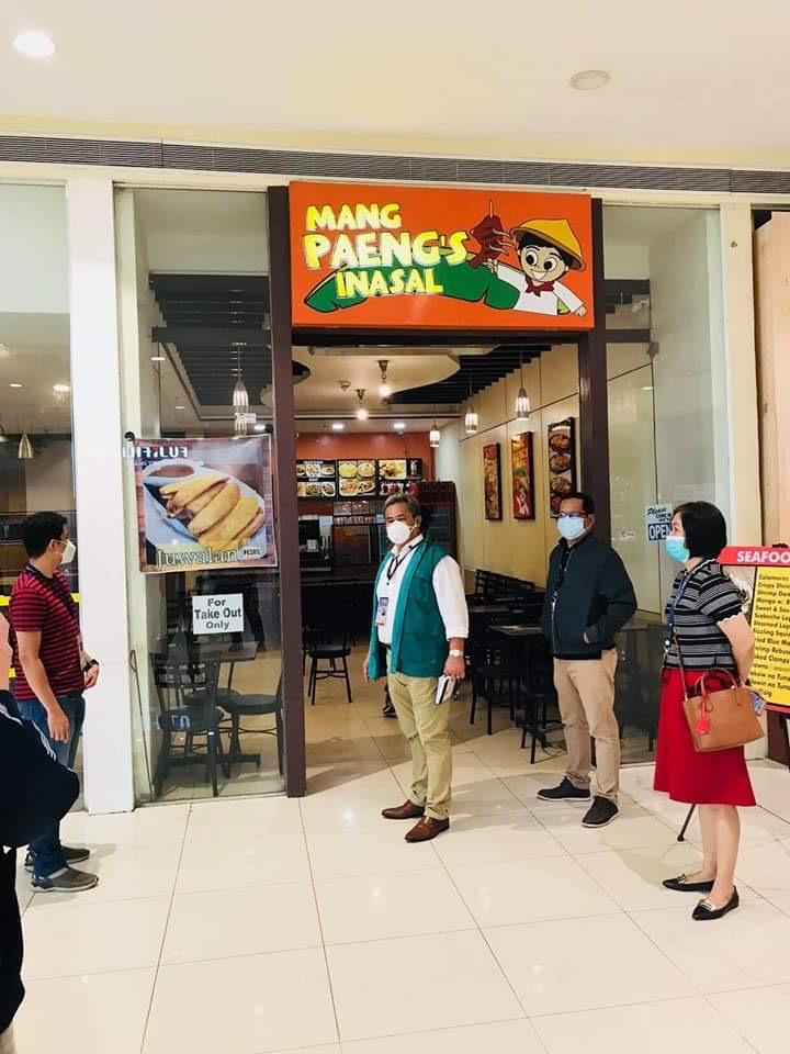 DTI inspectors outside a restaurant in a mall in Region 9