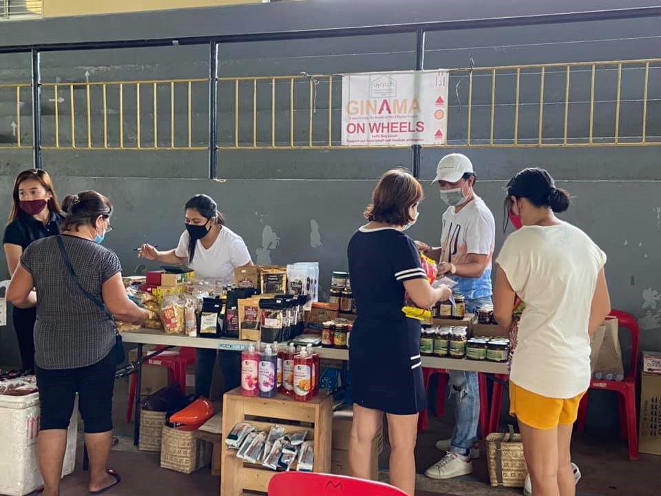 With face masks on, personnel of Ginama continue to sell local products of MSMEs through the Ginama on Wheels. (Photo by DTI MisOr)