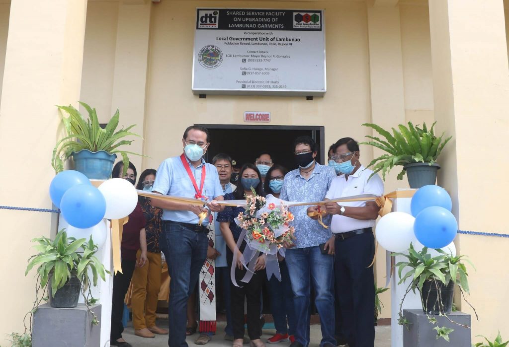 Iloilo Third District Board Member Jason Gonzales (left) leads the ribbon-cutting ceremony for the new building that will house the SSF on Garments Making in Lambunao, Iloilo. He is assisted by Municipal Mayor Reynor Gonzales (far right), Vice Mayor Arvin Losaria (second from right) and DTI Iloilo Provincial Office Trade Industry Development Analyst Shayne Jornadal (third from right).