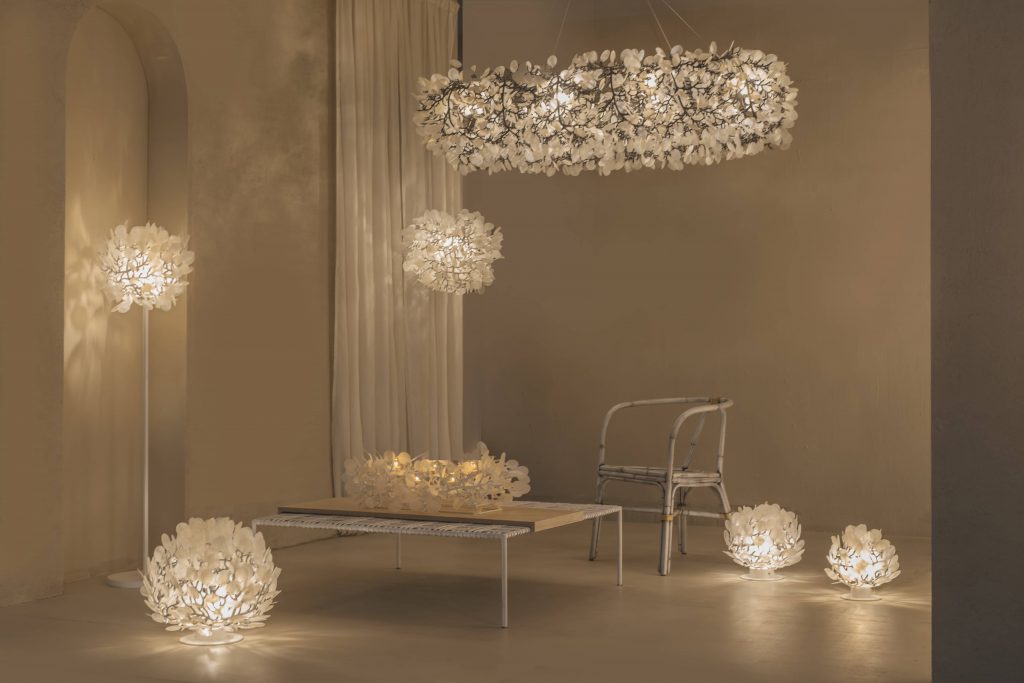 Pendant and floor lamps inspired by Cherry Blossoms are beautifully set-up against beige-colored floor and walls