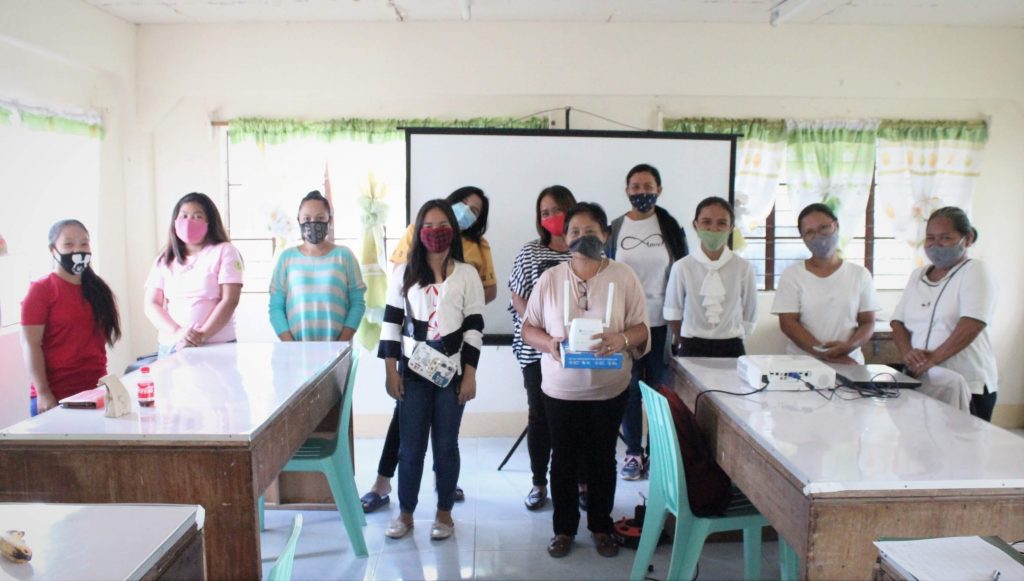 A group photo of the representatives who received the wifi modem from DTI.