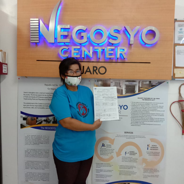 Ms. Ida Hilvano holding her Business Improvement Plan as a result of the trainings she attended. She hope to sustain her sari-sari store through the help of DTI-NSB-LSP.