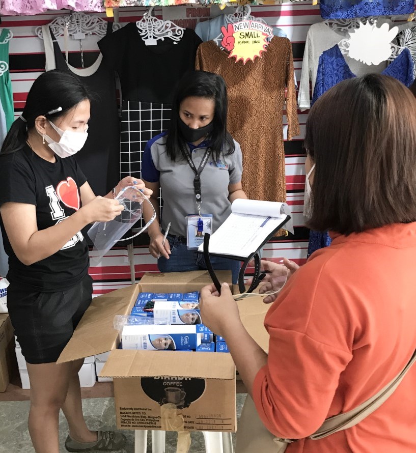 Staff monitoring face shields in one store in Davao del Norte