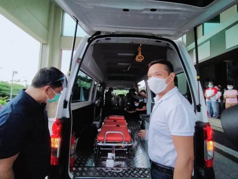 Dave M. Almarinez of the Philippine International Trading Corporation (PITC) receives donation of a new patient transport vehicle (PTV)