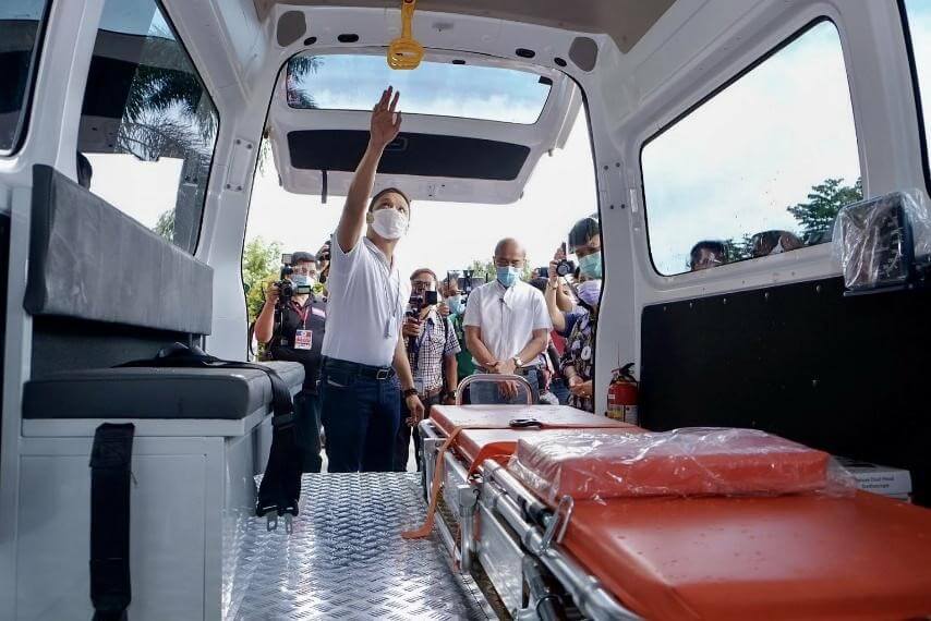 Dave M. Almarinez of the Philippine International Trading Corporation (PITC) receives donation of a new patient transport vehicle (PTV)