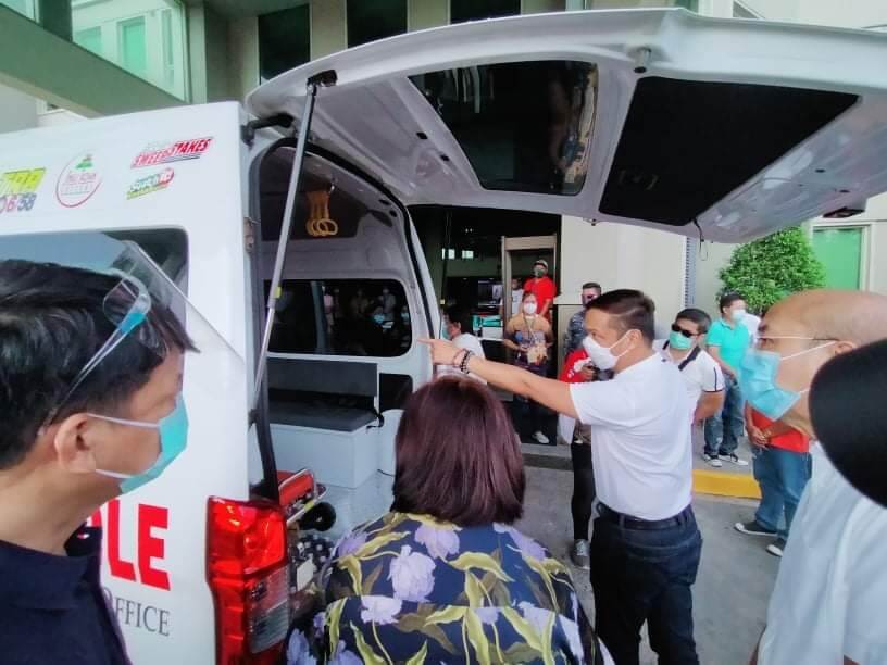 Dave M. Almarinez of the Philippine International Trading Corporation (PITC) receives donation of a new patient transport vehicle (PTV)