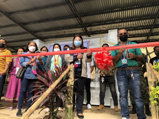 DTI Misamis Oriental officials cutting the ribbon as they commence the official turnover of the bamboo processing hub