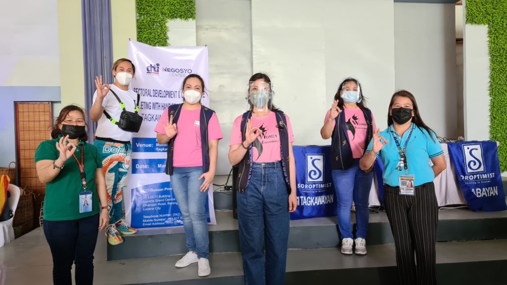 Six attendees pose for a photo