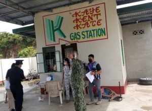 in photo: Perez PNP together with NC Alabat in conducting the joint inspection on health standard protocol in a Gasoline station