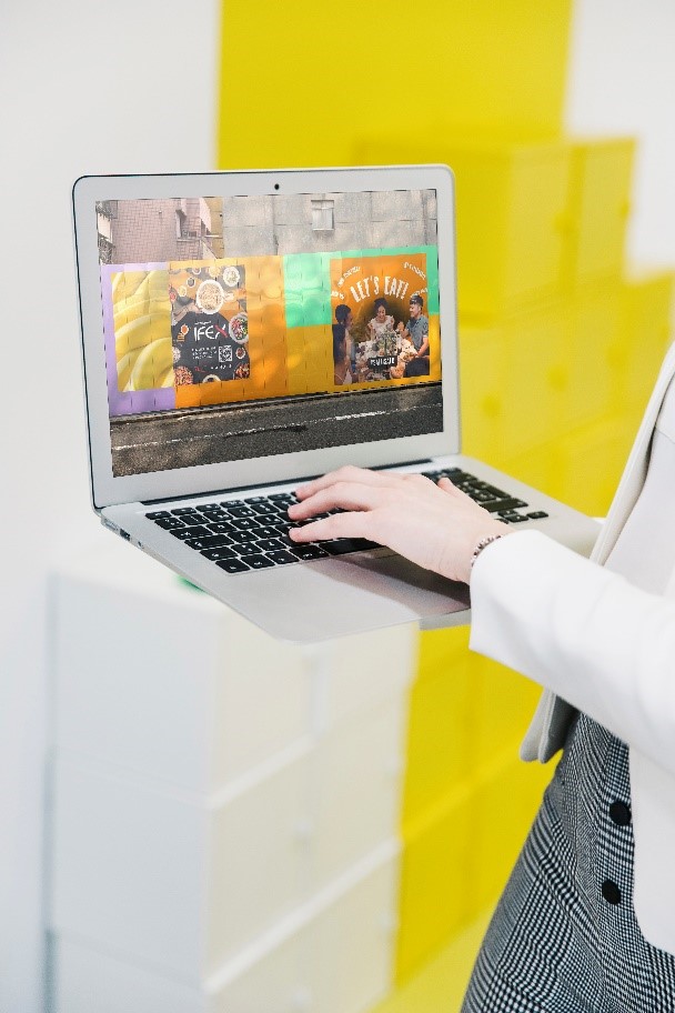 Photo of person holding a laptop