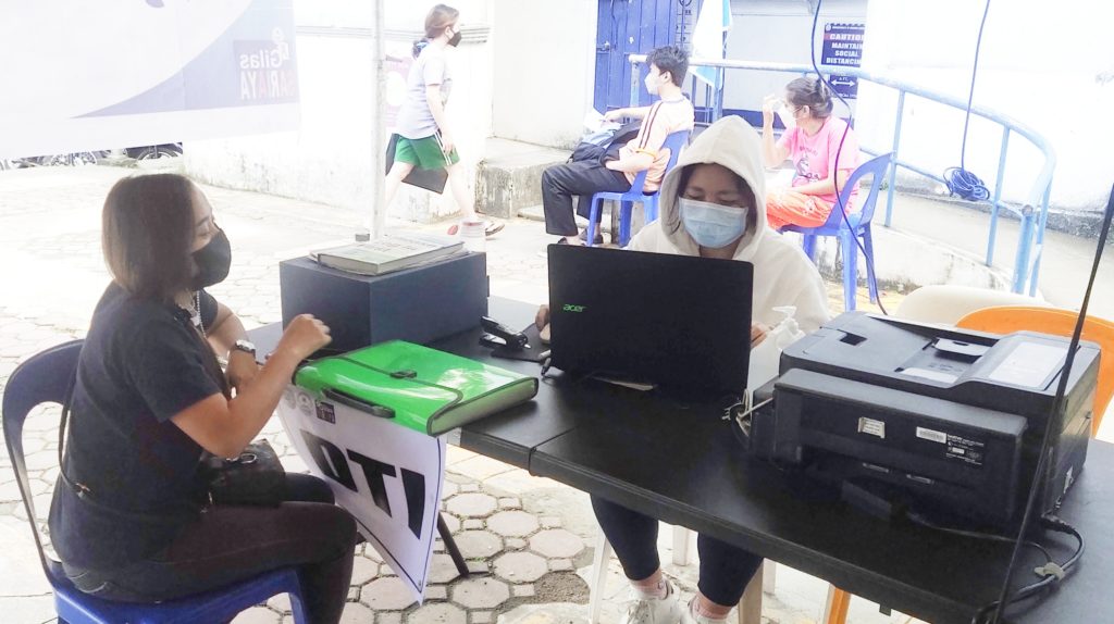 in photo: Senior Business Counselor Shayne B. Nocus of DTI NC Sariaya assisting a client