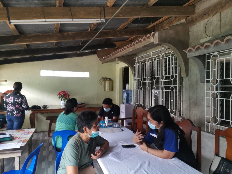 in photo: LGU personnel conducting validation process on a potential PPG beneficiary