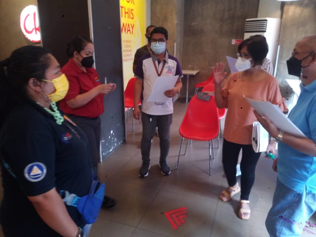 In photo: Safety Seal Certification Team inspecting a food establishment