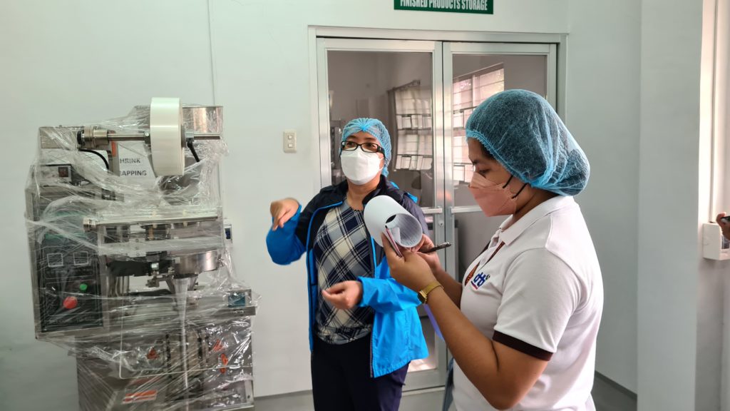 Admin Leizel Luneta reviewing the documents and checking the machines and equipment one by one