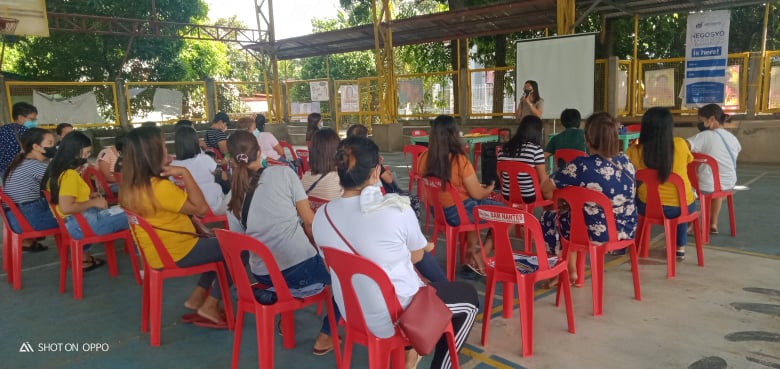 Negosyo Center Tayabas City Business Counselor, Ms. Jon Emilou M. Encomienda, explaining the DTI-Negosyo Center Services and the program Negosyo Serbisyo sa Barangay, and Consumer Rights and Responsibilities.