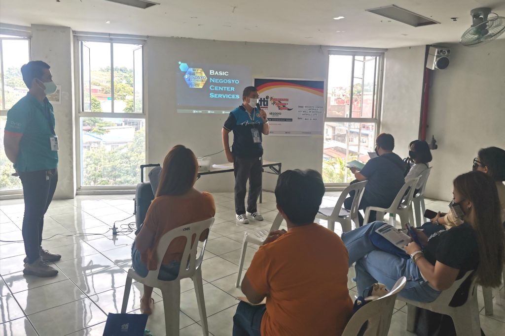 In Photo: Negosyo Center Business Counselor Andres presenting the DTI programs and services.
