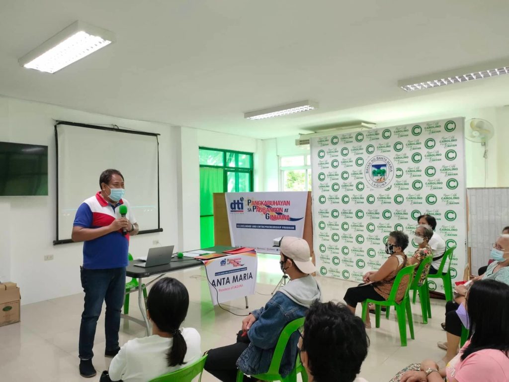 In Photo: Arnel Magpily of DTI Laguna giving his welcome message