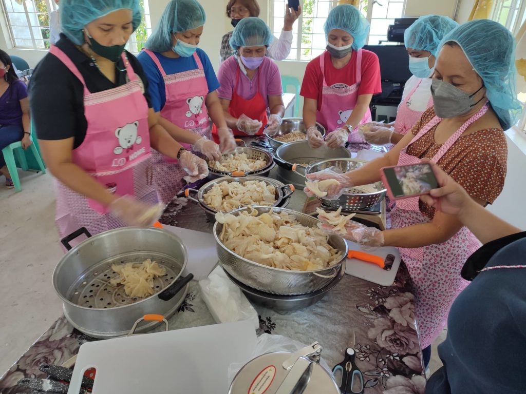in photo: CARPreneurs processing their mushroom product