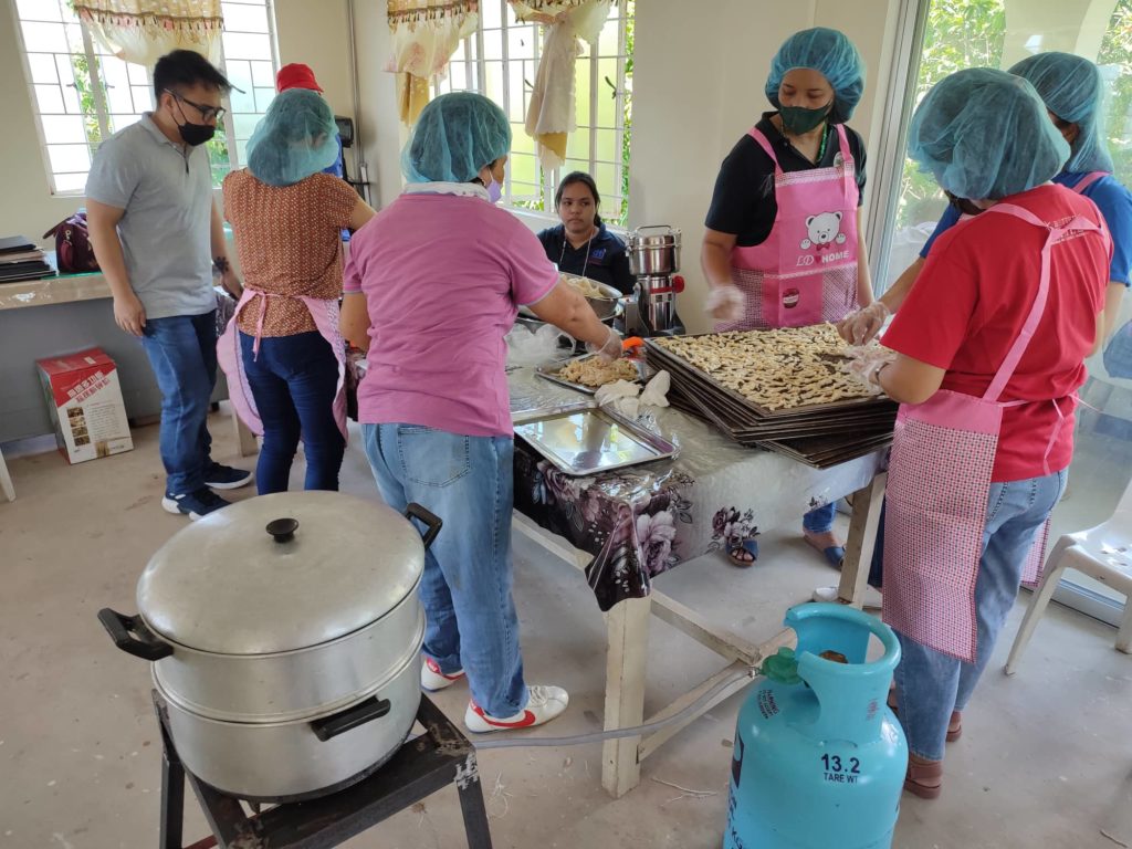 in photo: CARPreneurs processing their mushroom product