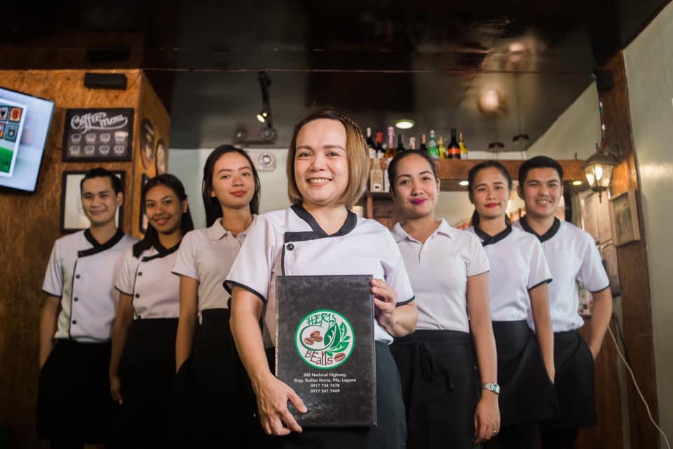 Triwil Herbs and Beans Café employees together with its owner