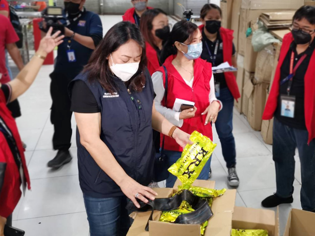 Consumer Protection Group (CPG) Undersecretary Atty. Ruth B. Castelo and Fair Trade Enforcement Bureau (FTEB) Officer-In-Charge Director Atty. Marimel D. Porciuncula inspect confiscated inner tube from a firm in Binondo, Manila.