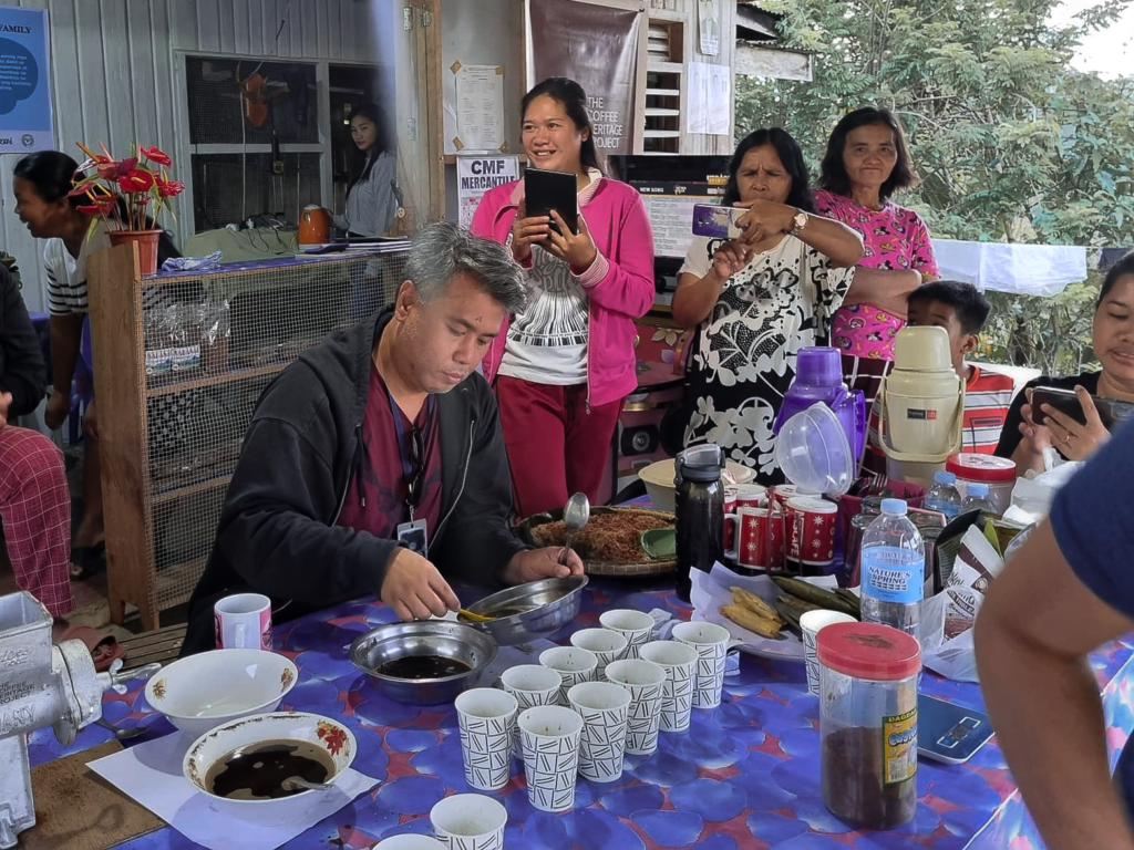 Instructor demonstrates methodologies for planting coffee