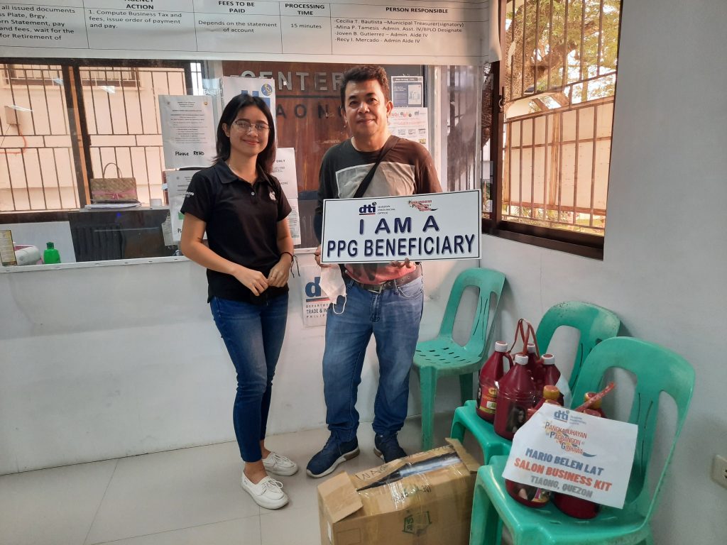 Negosyo Center Business Counselor together with one of the PPG beneficiaries in Tiaong, Quezon.