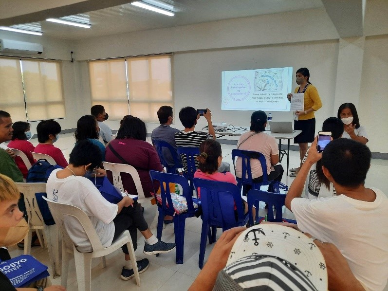 In photo: Negosyo Center Business Counselor - Cainta Jaymie Benito, discussing the Simple Business Plan.