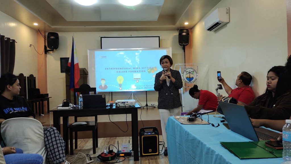 in photo: Ms. Meg B. Marzan, while conducting her discussion with the first module entitled "Entrepreneurial Mind-Setting and Values Formation"
