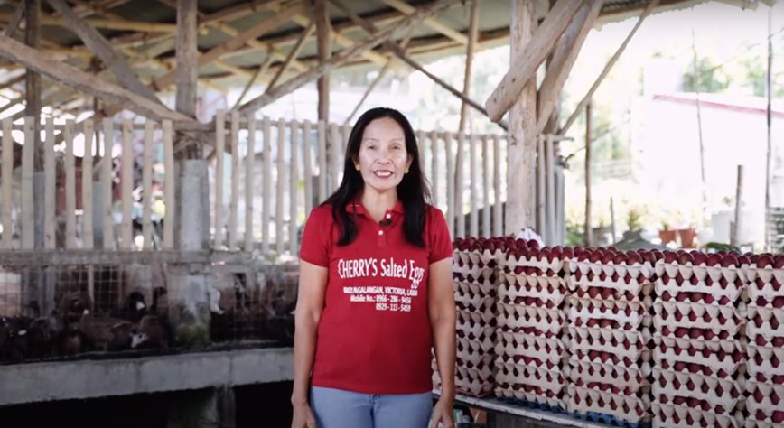 Ms. Serapia “Cherry” Cano Jimenez, together with her salted egg products.