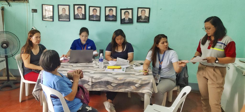 in photo: Negosyo Center–Sariaya, Business Counselor Shayne B. Nocus, LGU Sariaya, Ms. Abigail Magyawe Business Permit and Licensing Office (BPLO) and Ms. Michelle Coronel from the Municipal Planning and Development Office (MPDO), assisting tenant of Sentrong Pamilihan ng Produktong Agrikultura sa Quezon.