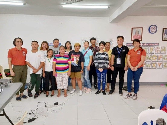 In photo: Negosyo Center San Mateo Business Counselor Christian Ray B. Libao, FWD Insurance and Human & Inclusion NGO, together with PWD beneficiaries in Cainta.