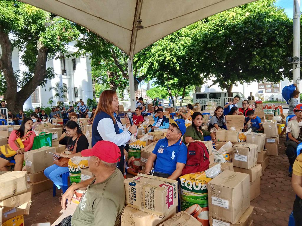 A staff from DTI looks like giving an inspirational message to the beneficiaries
