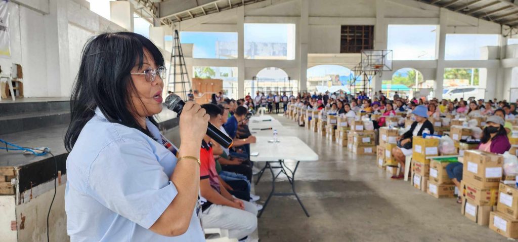 Regional Director Edna Dizon speaking at an event