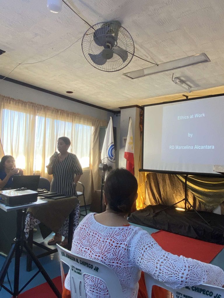 Speaker presenting at an employment coaching event.