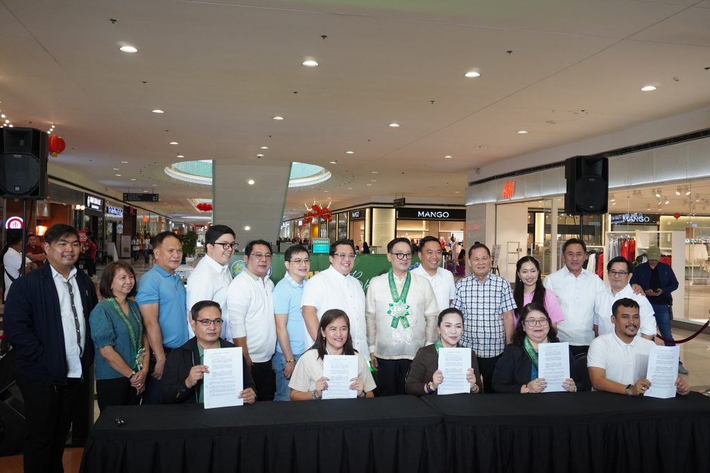DTI and City of Dasmariñas LGU officials posing for a photo during the launch OTOP Store in SM Dasmariñas
