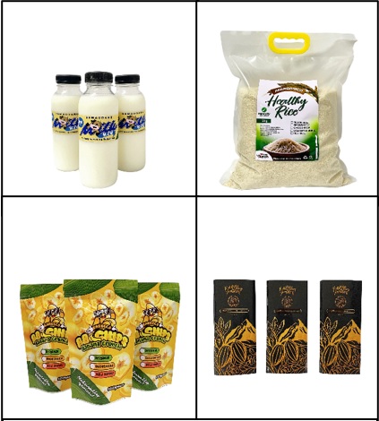 Four quadrants showcasing different products from agrarian reform beneficiaries in Bukidnon, Philippines. Top left: Three bottles of fresh milk with blue and yellow labels. Top right: A clear plastic bag of naturally-grown rice labeled 'Healthy Rice.' Bottom left: Three packets of banana chips with colorful packaging. Bottom right: Three bars of chocolate with elegant black and gold packaging. These products were enhanced by the DTI-CARP product development project to improve marketability and competitiveness.