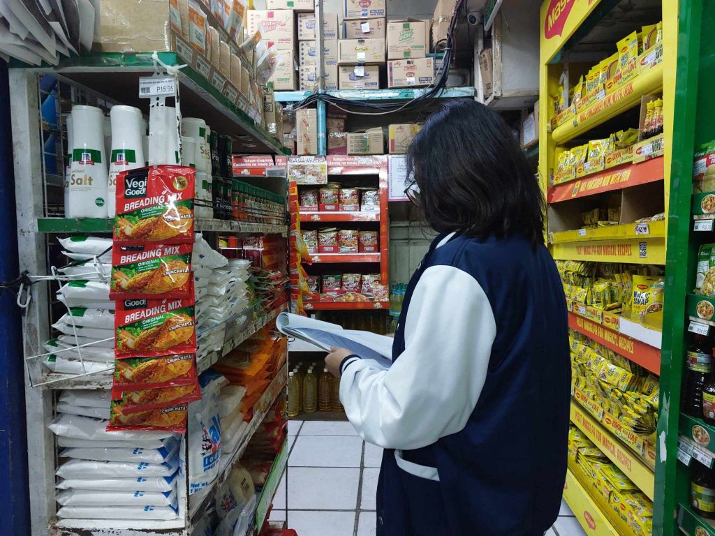 Staff from the DTI Laguna Provincial Office - Consumer Protection Division conducting aroutine monitoring of price and supply of basic necessities and prime commodities in an establishment