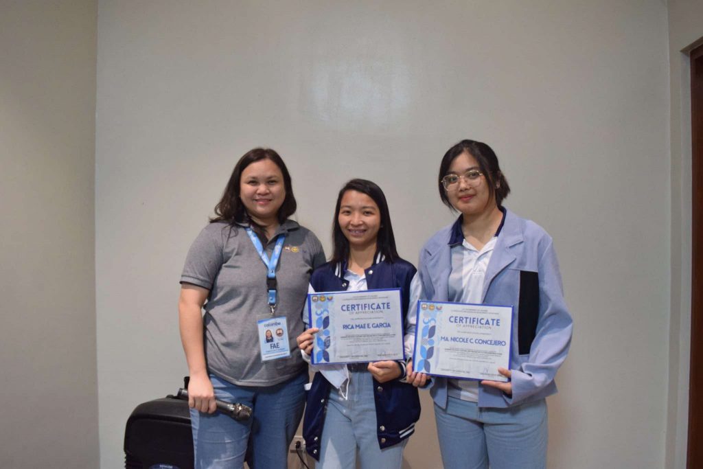 Three women pose with certificates; DTI-Laguna event for Calamba MSMEs on pricing, costing, and consumer education.