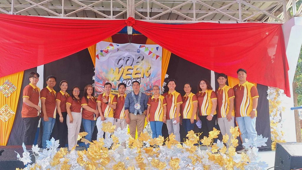 A group photo of DTI 4-A Rizal’s Jerome Montealegre and the University of Rizal System Pililla Campus College of Business team on stage during the 2025 College of Business Week celebration.