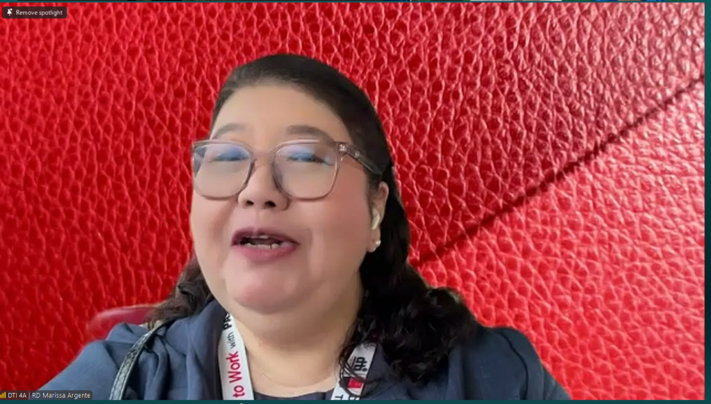 A screenshot of DTI 4-A Regional Director Marissa Argente speaking during the 2025 KMME-MME Online Program, shown against a red background.