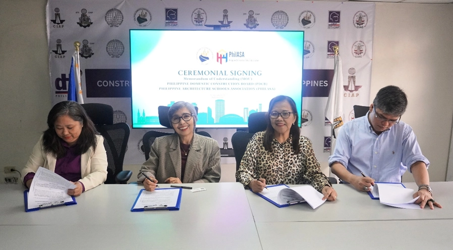 Representatives from PDCB and PHILASA hold signed documents during the ceremonial signing event. From left to right: PDCB Division Chief Engr. Jocelyn Carrasco, PDCB Executive Director Doris U. Gacho, PHILASA President Ar. Jean Cornejo, and PHILASA Vice President for Programs, Ar. Sylvester Seno.