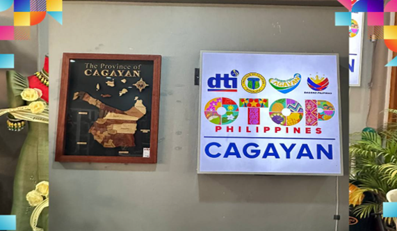 DTI OTOP Philippines store sign for Cagayan Valley, next to framed map of Cagayan province.