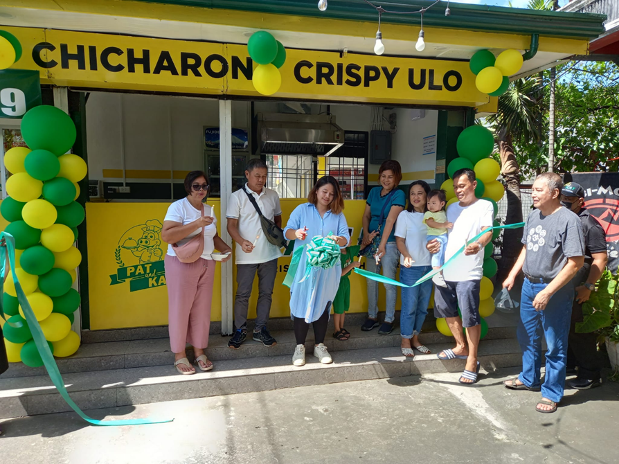 Ribbon cutting during the opening of Pat & Kat Pork Chicharon store.